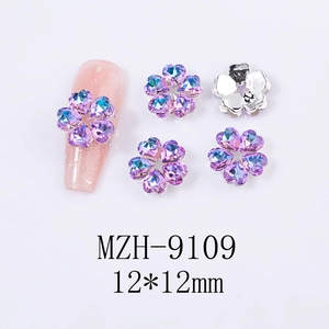 Macro view of 12mm purple aurora heart-shaped crystal nail charms with silver metal base