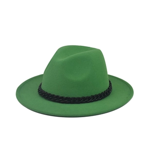 Detail of bright green wool fedora hat featuring a chunky black chain band decoration