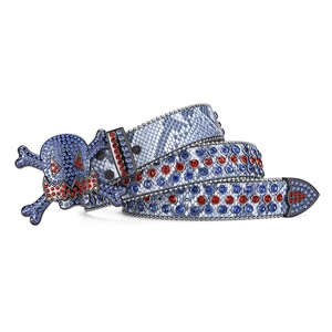 Detail of skull buckle with red and blue rhinestones on snake-textured leather belt