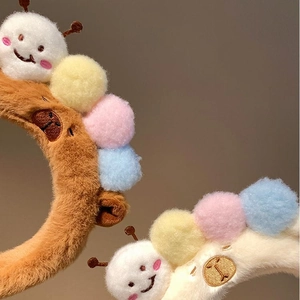 Cute caterpillar plush headbands in brown and white with colorful pom-poms for winter