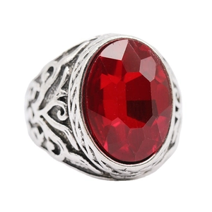 Vintage geometric silver ring featuring a large oval red crystal with ethnic carved details