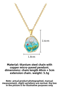 Macro view of gold titanium steel chain with enamel leaf and pearl inlay pendant detail