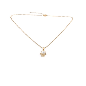 Detail of gold Hamsa hand pendant with sparkling zircons on a delicate link chain