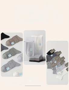 Detail of breathable mesh texture and cool-touch label on men's low-cut cotton socks