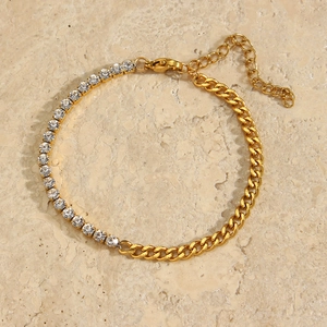 Detailed view of gold Cuban chain bracelet with sparkling white zircon tennis link
