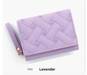 Detail of lavender PU leather wallet featuring heart embroidery and woven texture