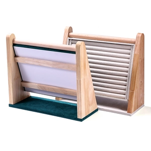 Wooden jewelry display tray with tiered velvet slots for rings and earrings