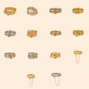 Detailed grid of geometric multilayer stainless steel rings in gold and silver finishes
