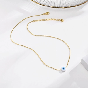 Golden stainless steel necklace with white evil eye pendant and adjustable lobster clasp
