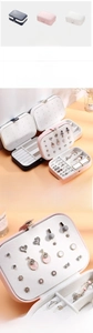 Detail view of double-layer PU leather jewelry box with earring slots and necklace hooks