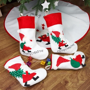 Set of 4 white Nordic embroidered Christmas stockings with Santa and elf designs