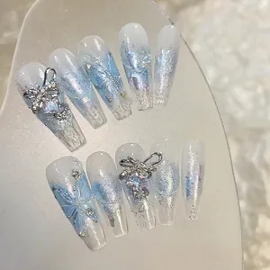 Sparkly butterfly press-on nail set with blue gradients and iridescent silver glitter