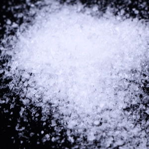 Macro shot of artificial white decorative snow powder showing texture and crystal grains