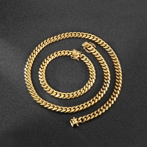 8mm golden titanium steel Cuban link chain necklace and bracelet set on black background