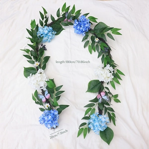 Detail of 180cm fall hydrangea garland with blue and white flowers and green leaves