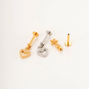 Titanium flat back stud jewelry set with gold heart and star dangles and clear zircon