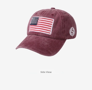 Detail of burgundy washed cotton baseball cap with USA embroidery on the side