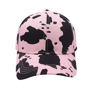 Pink and black cow print baseball cap with six-panel structure and curved brim