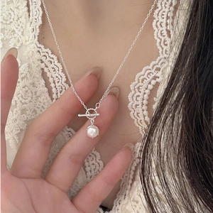 S999 silver pearl necklace with OT toggle clasp worn by model for elegant style