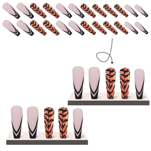 Detail of nude pink French tips and orange tiger stripe patterns on long fake nails
