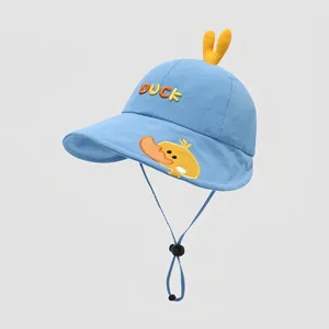 Detail of blue cotton sun hat with cartoon duck embroidery and adjustable chin strap