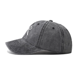 Detail of vintage gray washed cotton baseball cap with white bow embroidery