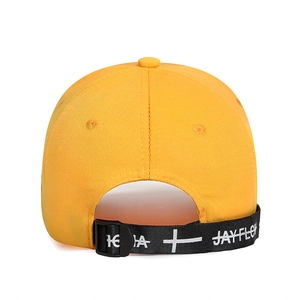 Bright yellow baseball cap with extended black JAYFLOW branded strap and plastic buckle