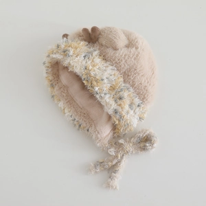 Detail of plush faux mink fur kids winter hat with deer antlers and ear flaps