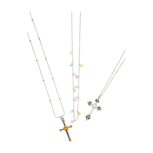 Vintage cross bowknot necklace set with rhinestones and colorful beads on white background