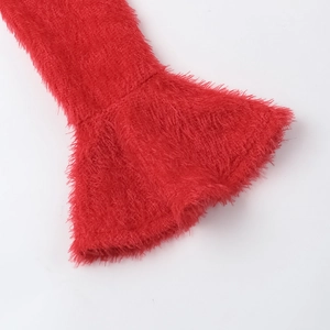 Detail shot of the long red faux fur flare sleeve on a slim fit elegant autumn dress