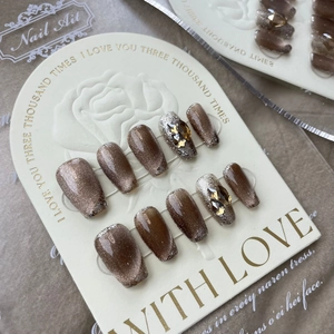 Handmade brown cat-eye press-on nails with sparkling rhinestones and silver glitter