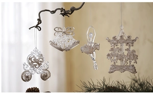 Clear acrylic Christmas ornaments featuring pumpkin carriage and ballet dancer with silver glitter
