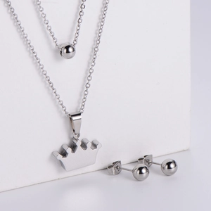 Polished crown pendant necklace and round bead stud earrings set in silver stainless steel