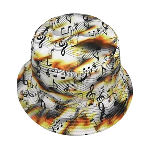 Detailed close-up of music note print on yellow and orange gradient bucket hat fabric