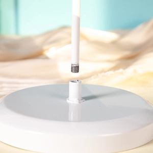 Detail showing the threaded screw assembly of the white metal jewelry display stand base
