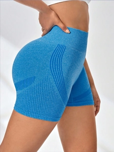 Detail view of seamless high-waisted royal blue yoga shorts with scrunch butt lifting effect
