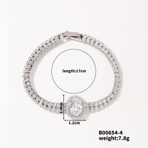 Detail shot of a silver rhinestone bracelet with large oval centerpiece and item specs