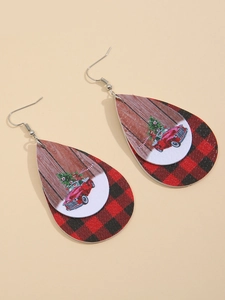 Detail of teardrop leather earrings featuring red Christmas truck and red black plaid