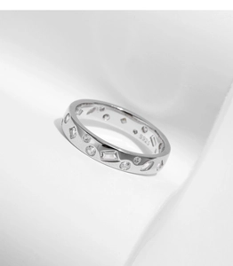 Detailed view of S925 sterling silver stamp and irregular zircon stones on ring band