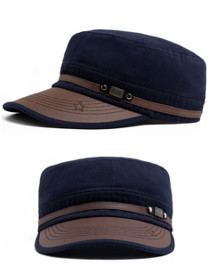 Detail of navy cotton military cap featuring a brown leather brim and star stitching