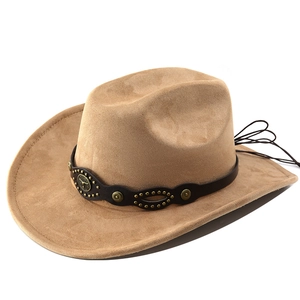 Detail of tan suede cowboy hat featuring metal bull head badge and bronze studded band