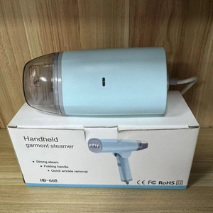 Detail view of portable handheld steamer with folding handle and safety certifications