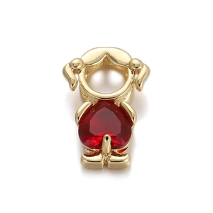 Macro detail of golden girl charm with red heart gemstone and white pearl bead