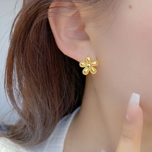 Chic 925 sterling silver golden flower stud earrings with beaded petals worn by model