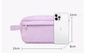 Detailed view of light purple corduroy makeup bag with size dimensions and phone reference
