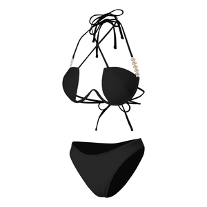Detail of black bikini top featuring elegant white pearl bead accents on halter straps
