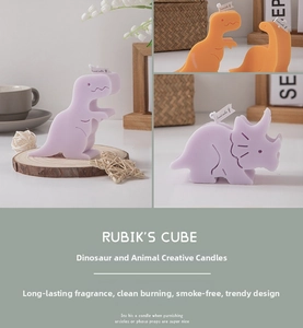 Detailed close-up of cute cartoon dinosaur scented candles with decorative paper tags