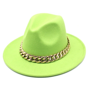 Detail of neon green wool fedora hat featuring a chunky gold metal Cuban chain decoration