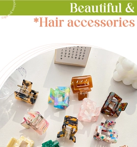 Flat lay of multiple acetate shark hair clips with tortoiseshell and marble patterns