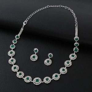Elegant bridal silver necklace and earring set with green round stones and zircon